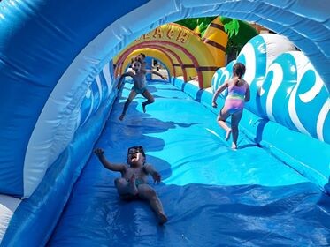 Buikschuifbaan op zomerkamp Aartselaar